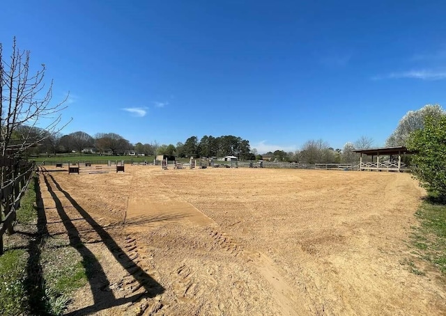 view of yard with a rural view