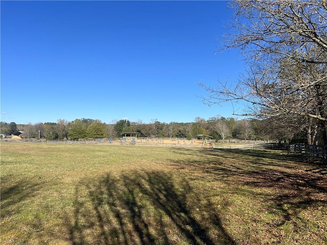 view of yard with a rural view