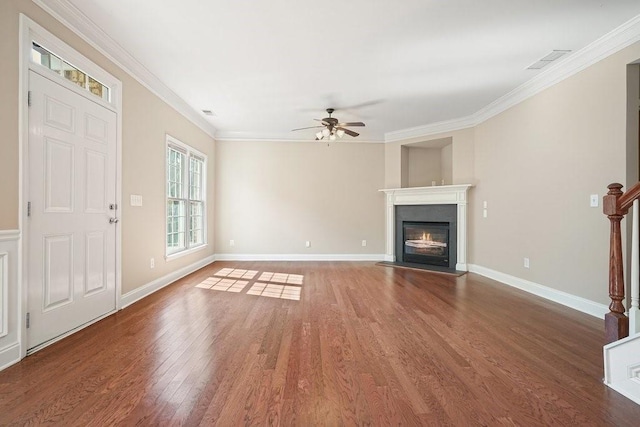 unfurnished living room with ceiling fan, ornamental molding, and dark hardwood / wood-style floors