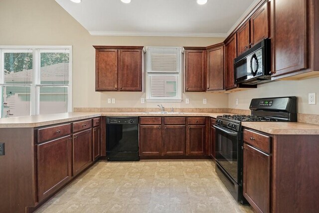 kitchen featuring sink, crown molding, black appliances, and kitchen peninsula