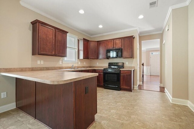 kitchen with black appliances, kitchen peninsula, ornamental molding, and sink