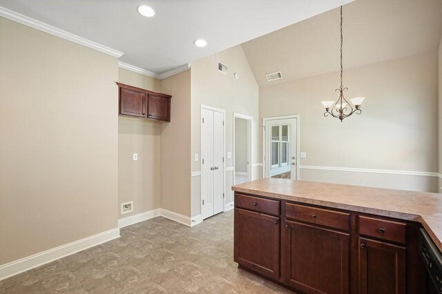 kitchen with black dishwasher, hanging light fixtures, ornamental molding, a chandelier, and vaulted ceiling