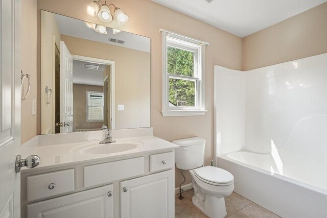 full bathroom featuring bathing tub / shower combination, toilet, tile patterned flooring, and vanity