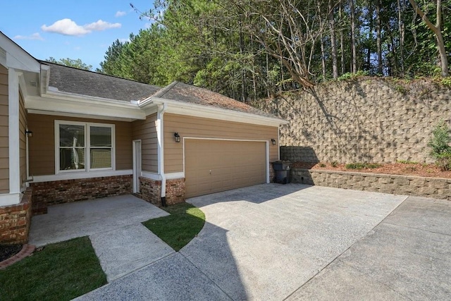 view of side of home with a garage