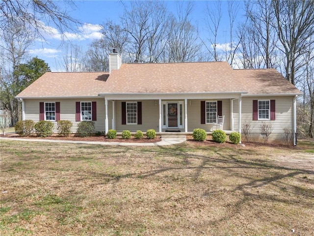 single story home with a shingled roof, a front yard, a porch, and a chimney