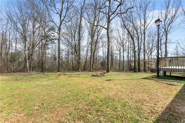 view of yard featuring a wooden deck