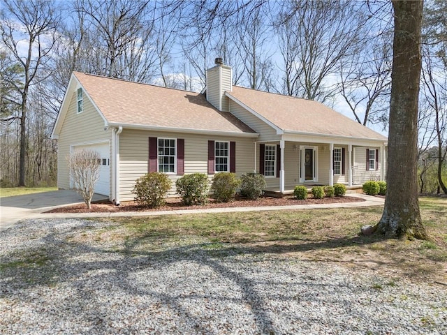 single story home featuring driveway, a porch, a chimney, and a shingled roof