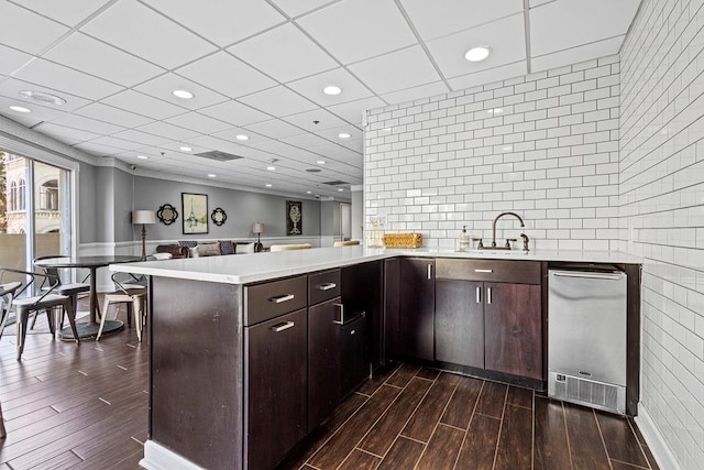 1 Biscayne Dr NW Unit 804, Atlanta, GA 30309 - kitchen with a sink, dark wood-style floors, a peninsula, dark brown cabinetry, and recessed lighting
