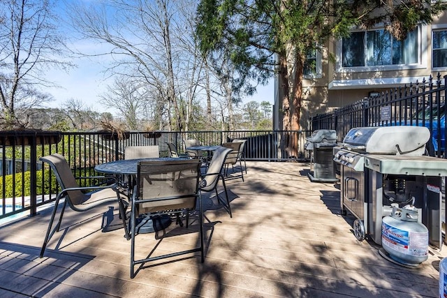 1 Biscayne Dr NW Unit 804, Atlanta, GA 30309 - view of patio with outdoor dining space, a wooden deck, and area for grilling
