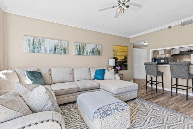 1 Biscayne Dr NW Unit 804, Atlanta, GA 30309 - living room featuring wood finished floors, ornamental molding, and ceiling fan