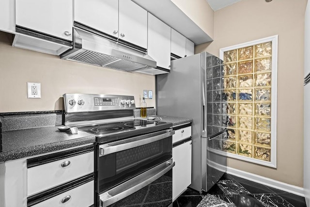 1 Biscayne Dr NW Unit 804, Atlanta, GA 30309 - kitchen featuring appliances with stainless steel finishes, under cabinet range hood, white cabinets, dark countertops, and baseboards