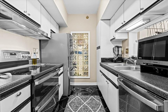 1 Biscayne Dr NW Unit 804, Atlanta, GA 30309 - kitchen featuring stainless steel appliances, under cabinet range hood, a sink, granite tiled floors, and white cabinetry