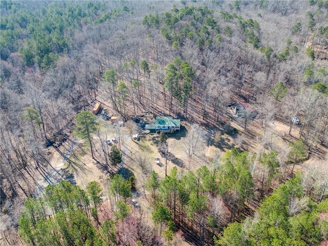 aerial view featuring a wooded view