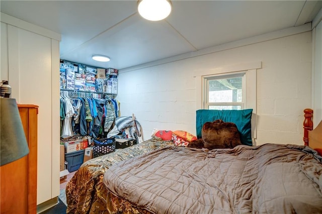 bedroom with concrete block wall