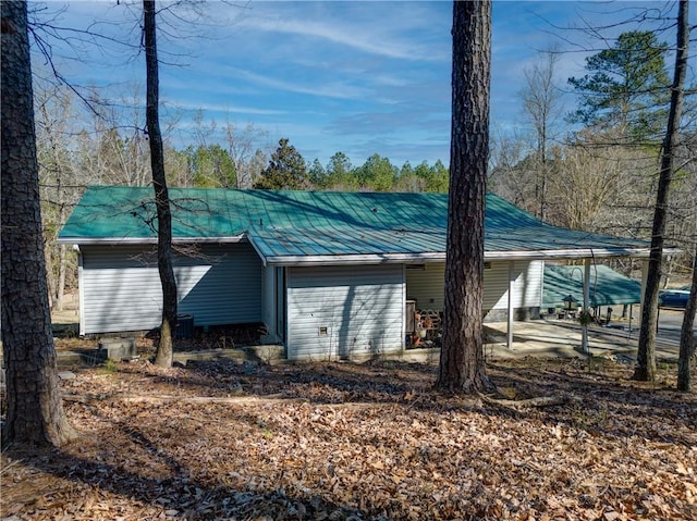 view of property exterior with metal roof