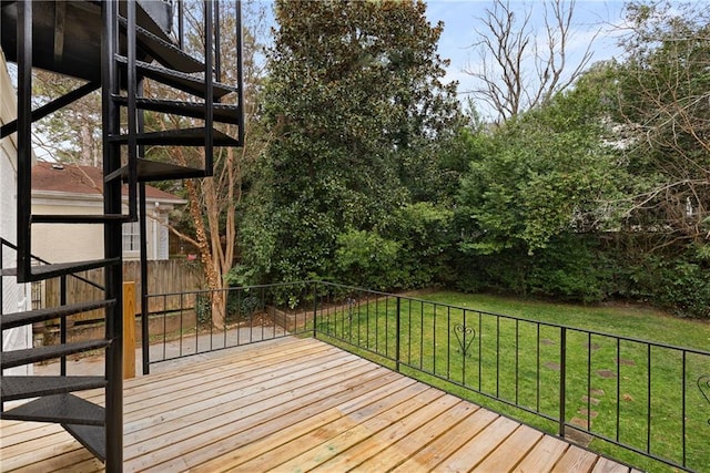 wooden deck with a lawn