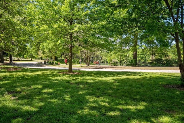 view of property's community with a lawn