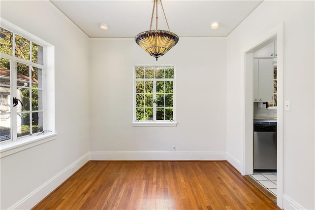 unfurnished dining area with light hardwood / wood-style floors