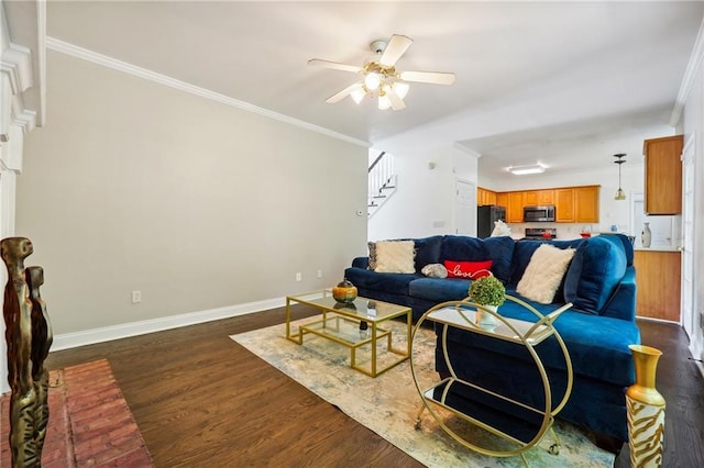 living room featuring ornamental molding, dark wood finished floors, baseboards, and stairs