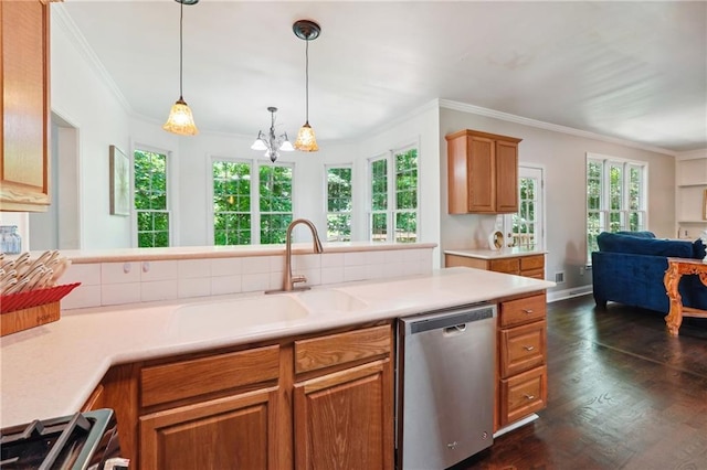 kitchen featuring gas range oven, open floor plan, dishwasher, and light countertops