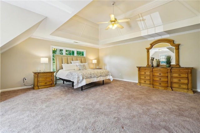 carpeted bedroom featuring lofted ceiling, multiple windows, a ceiling fan, and baseboards