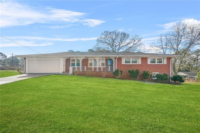 ranch-style home with a garage, covered porch, and a front lawn