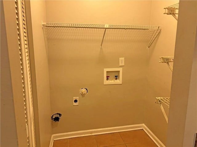 washroom featuring hookup for an electric dryer, hookup for a washing machine, and tile patterned flooring