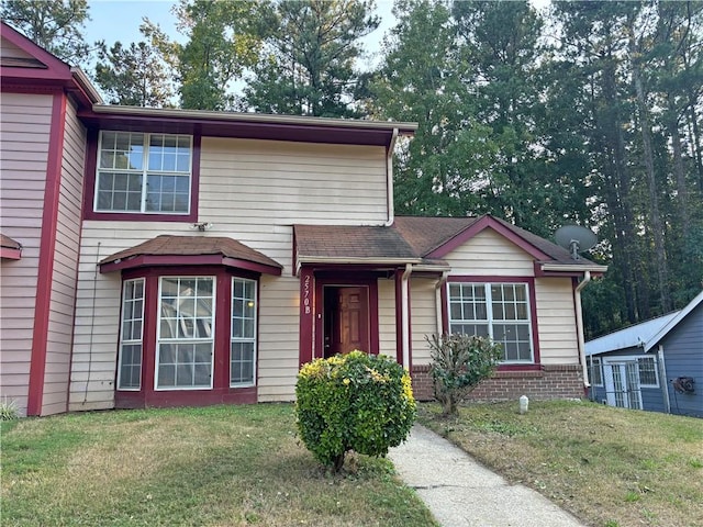 view of front facade with a front yard