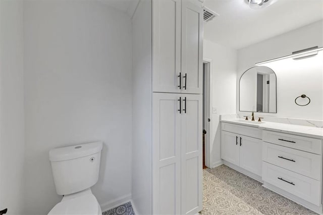 bathroom with toilet and vanity