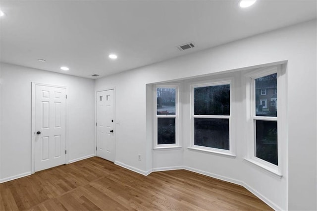 spare room featuring light hardwood / wood-style flooring