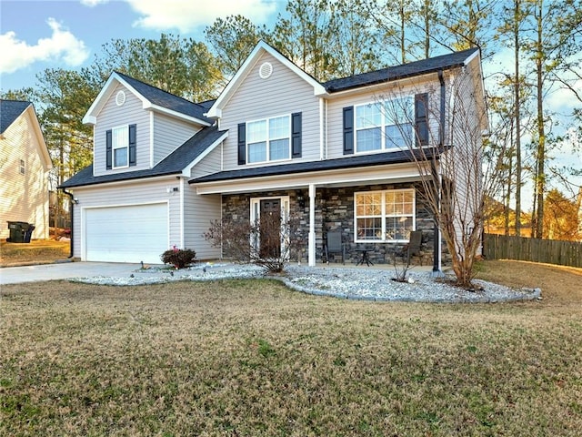 traditional-style home featuring driveway, stone siding, an attached garage, fence, and a porch