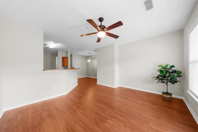 unfurnished living room featuring hardwood / wood-style floors and ceiling fan