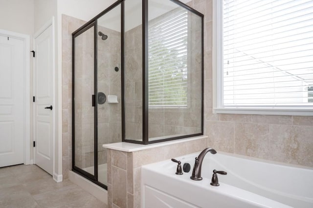 full bath featuring a shower stall and a bath