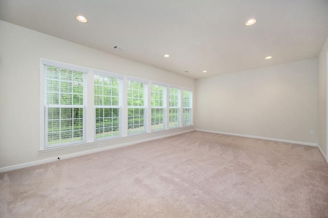 empty room with recessed lighting and baseboards