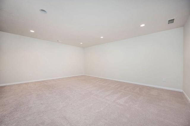 empty room with light colored carpet, baseboards, visible vents, and recessed lighting