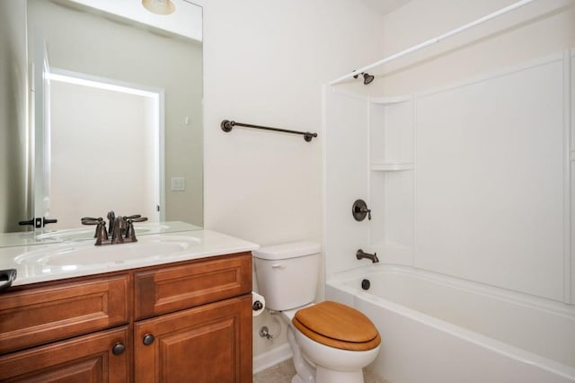 bathroom with vanity, bathtub / shower combination, and toilet