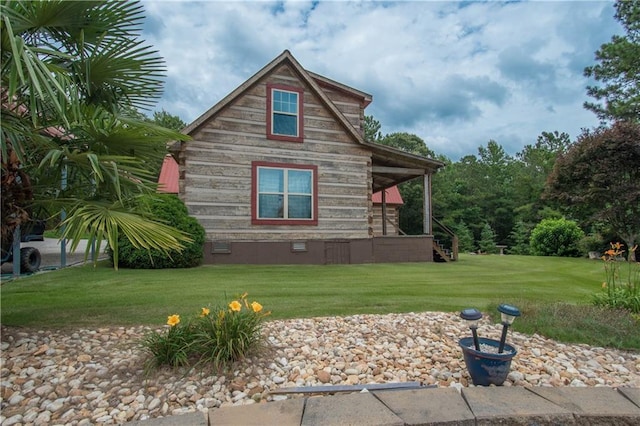 view of home's exterior with a lawn