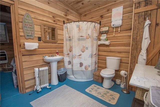 bathroom featuring toilet, wood ceiling, and radiator heating unit