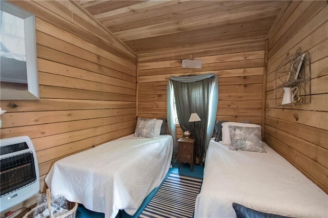 bedroom with wood walls and wood ceiling