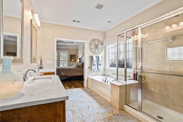 bathroom featuring ensuite bath, a bath, a shower stall, ornamental molding, and double vanity