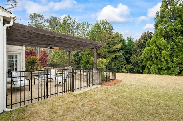 view of yard featuring a pergola, a patio area, and ceiling fan