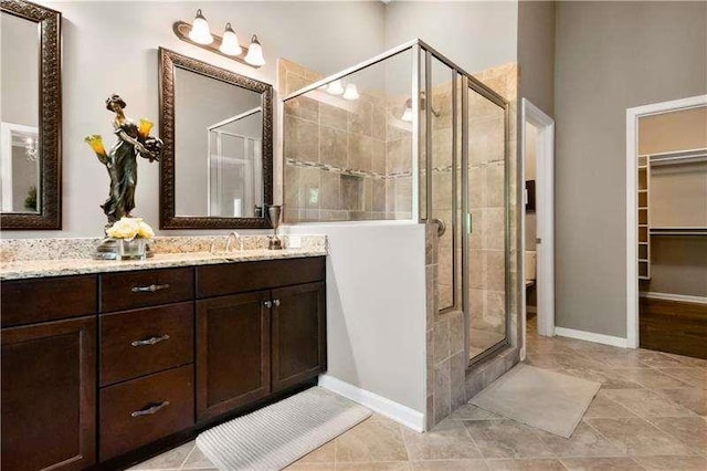 bathroom featuring vanity and walk in shower