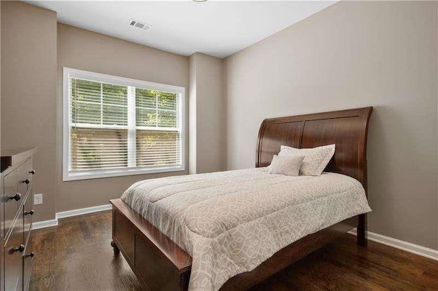 bedroom featuring dark hardwood / wood-style flooring