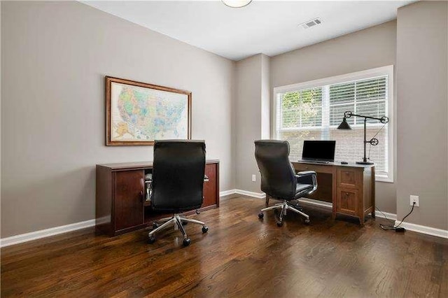 office with dark wood-type flooring