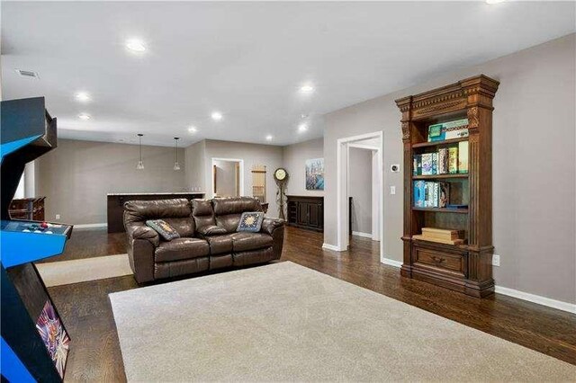 living room with dark hardwood / wood-style floors