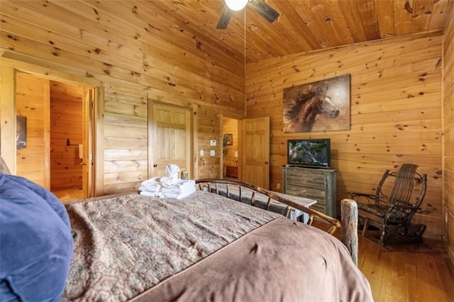 bedroom with wooden walls, wooden ceiling, and wood-type flooring