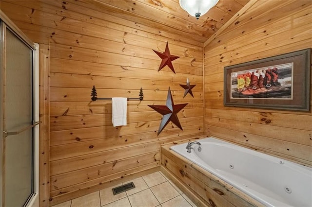 full bathroom with lofted ceiling, tile patterned flooring, a jetted tub, visible vents, and a stall shower