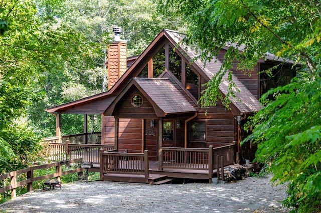 rear view of property with a chimney