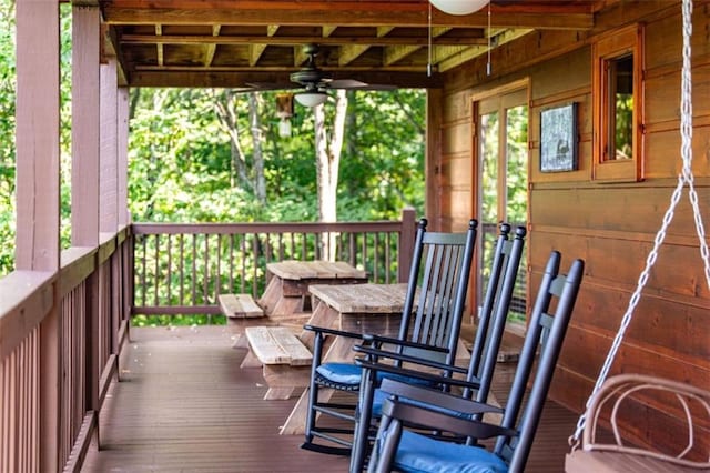 wooden terrace featuring ceiling fan