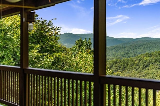mountain view with a wooded view